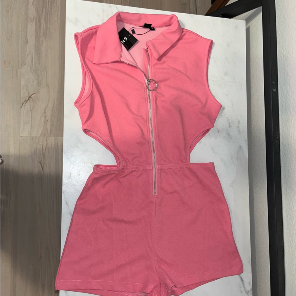 Pink romper with front zipper and side cutouts